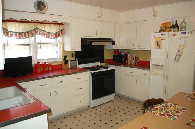 3414 North Seminary Avenue Chicago, IL 60657 - Photo 6 of 14 a kitchen with a refrigerator and a stove