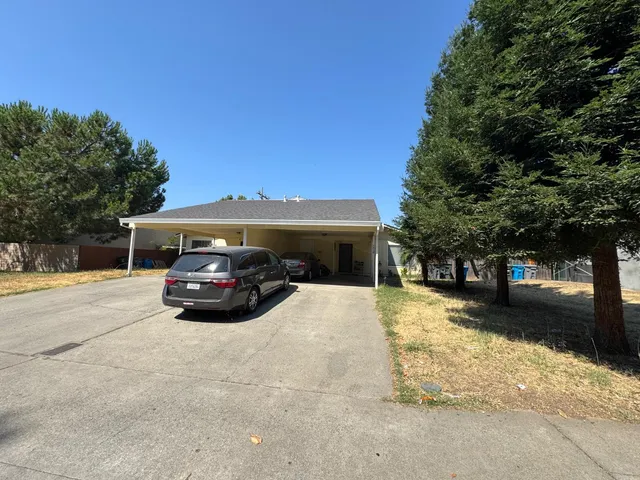 a view of street with parked cars
