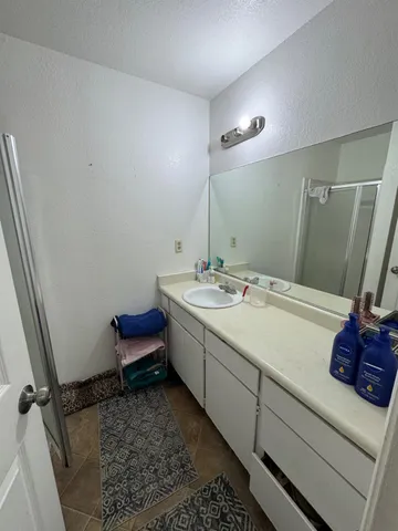 a bathroom with a sink and a mirror
