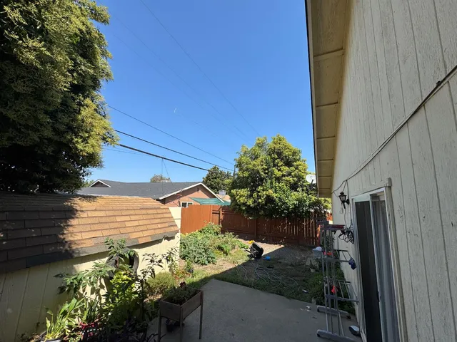 a view of a house with a flower garden