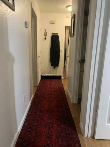 a view of a hallway view with staircase