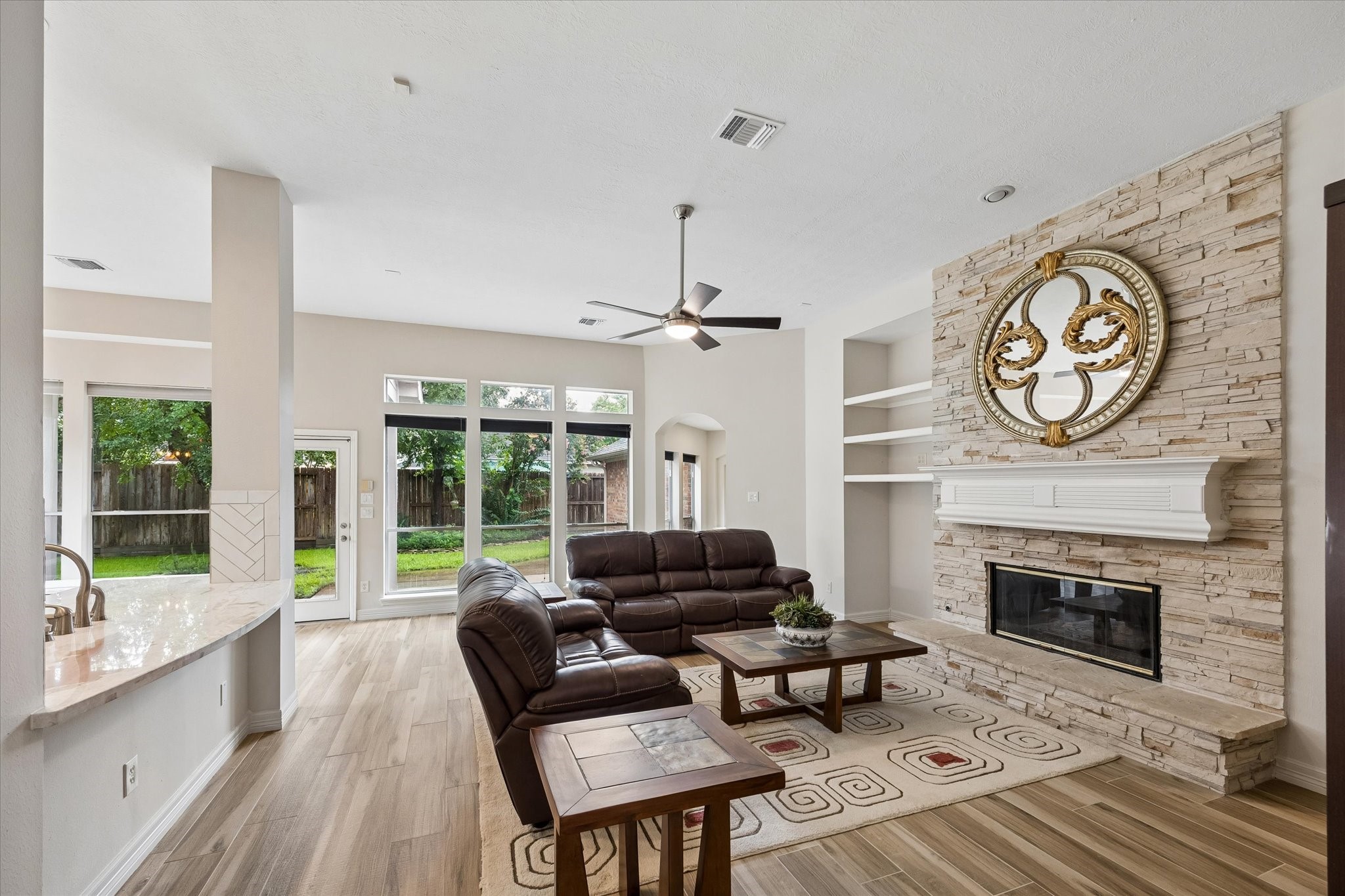 5306 Summerland Ridge Court Houston, TX 77041 - Photo 8 of 33 a living room with furniture a window and a fireplace