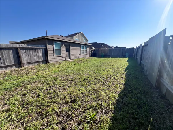 a backyard of a house with lots of green space