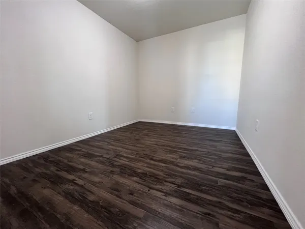 a view of wooden floor in an empty room