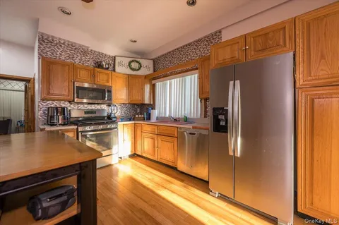 a kitchen with stainless steel appliances a refrigerator stove and sink