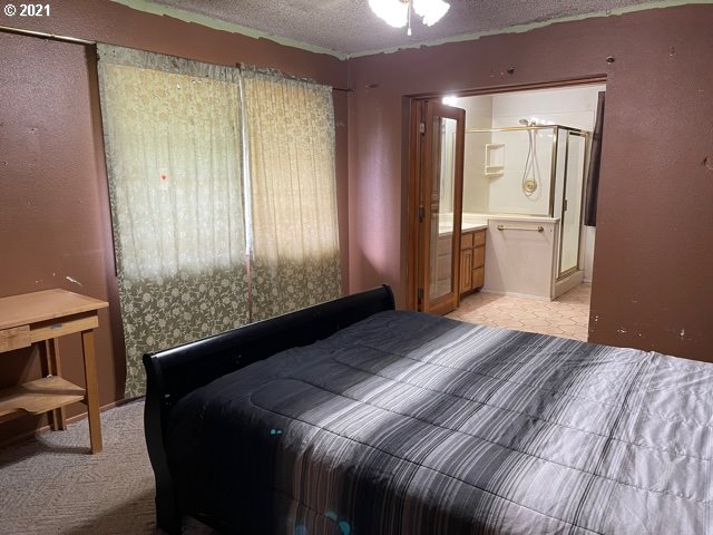 37811 Upper Camp Creek Road Springfield, OR 97478 - Photo 16 of 30 a bedroom with a bed and a window