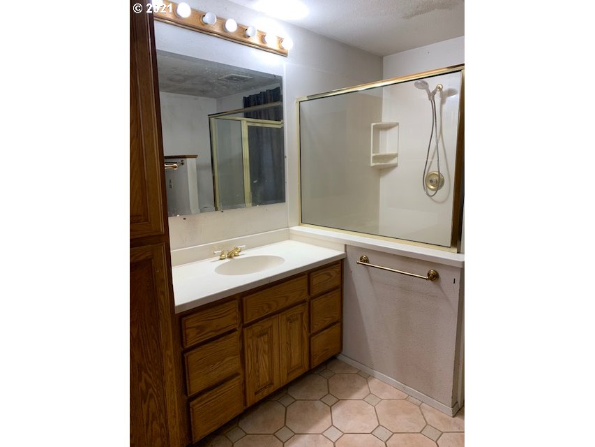 37811 Upper Camp Creek Road Springfield, OR 97478 - Photo 17 of 30 a bathroom with a sink and mirror
