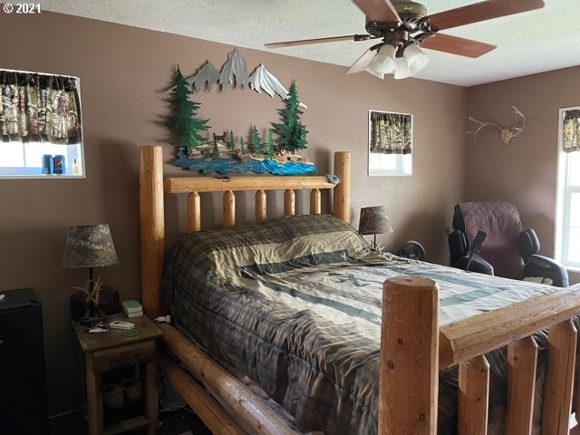 37811 Upper Camp Creek Road Springfield, OR 97478 - Photo 10 of 30 a bedroom with furniture and a window