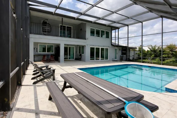 a view of a patio with chairs and a table