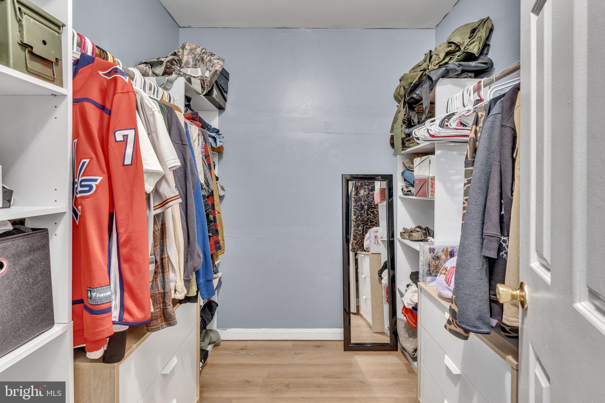 486 Round Up Road Lusby, MD 20657 - Photo 14 of 31 a view of walk in closet with clothes