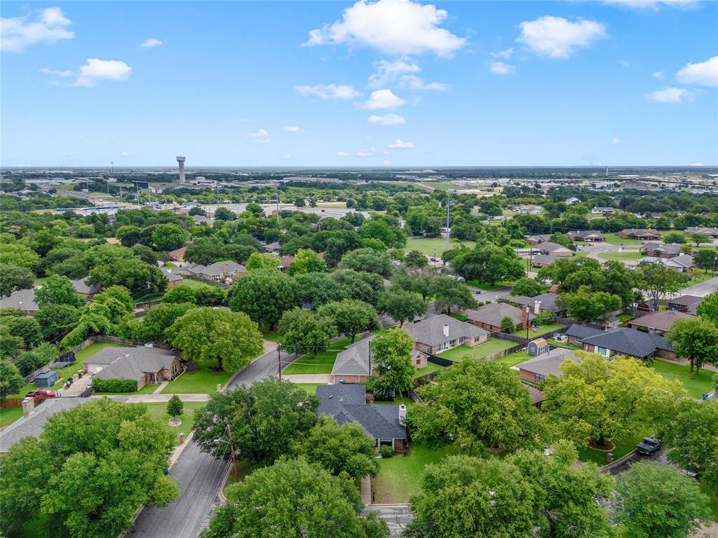 310 Ruth Drive Hewitt, TX 76643 - Photo 24 of 25 Residential neighborhood with mature trees, established properties, and a water tower in the distance