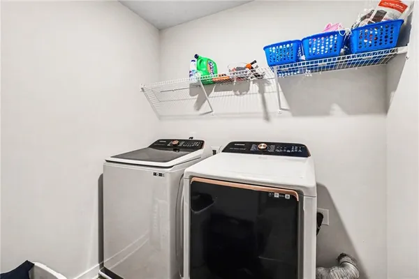a utility room with dryer and washer