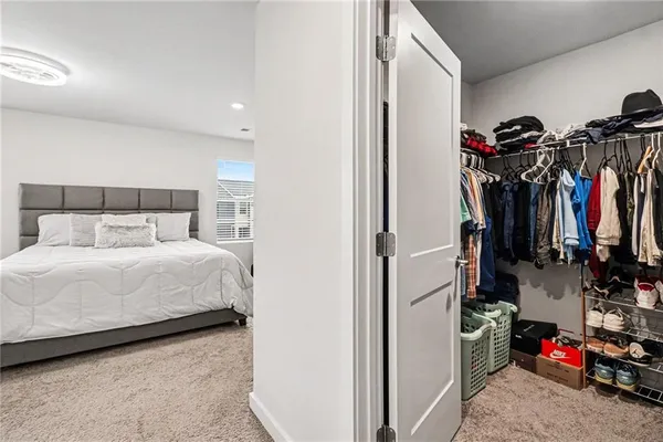 a bed room with a bed and a desk