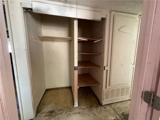 a view of an empty walk in closet