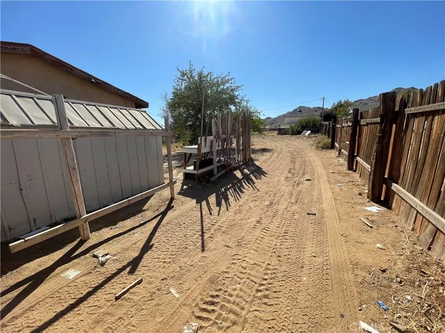 a view of a house with backyard and porch