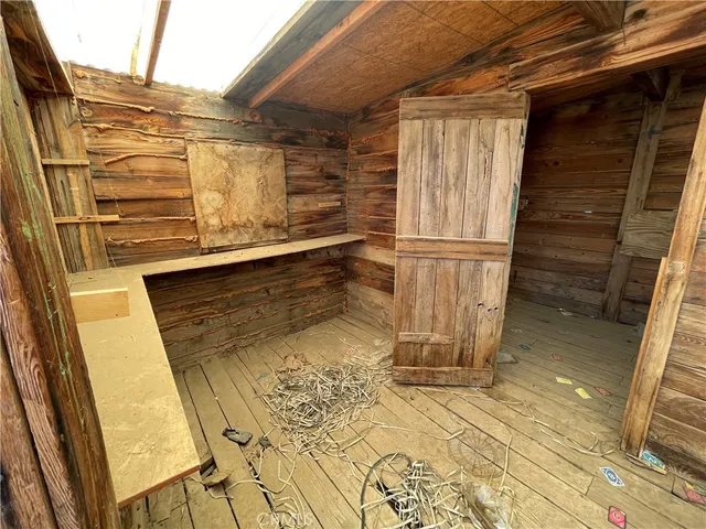 a view of a house with a snow yard and mountain view