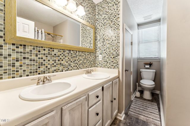 an empty room with a ceiling fan and a window