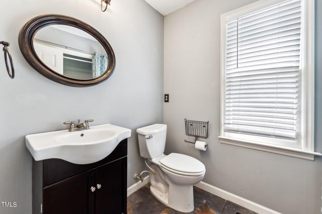 a very nice looking room with a large window and chandelier