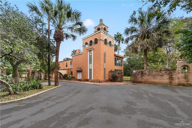 a view of a street with a building in the background