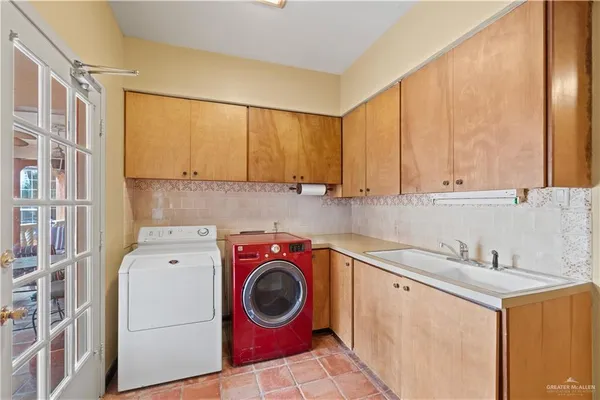 a utility room with dryer and washer