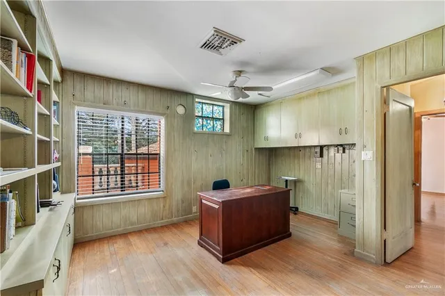 a work place with furniture and wooden floor