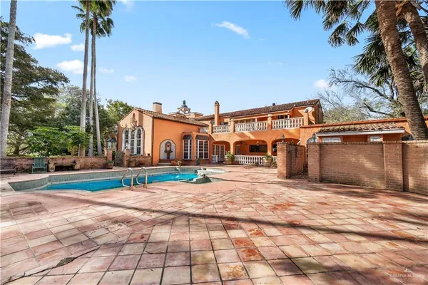 a view of a backyard of a house with a yard