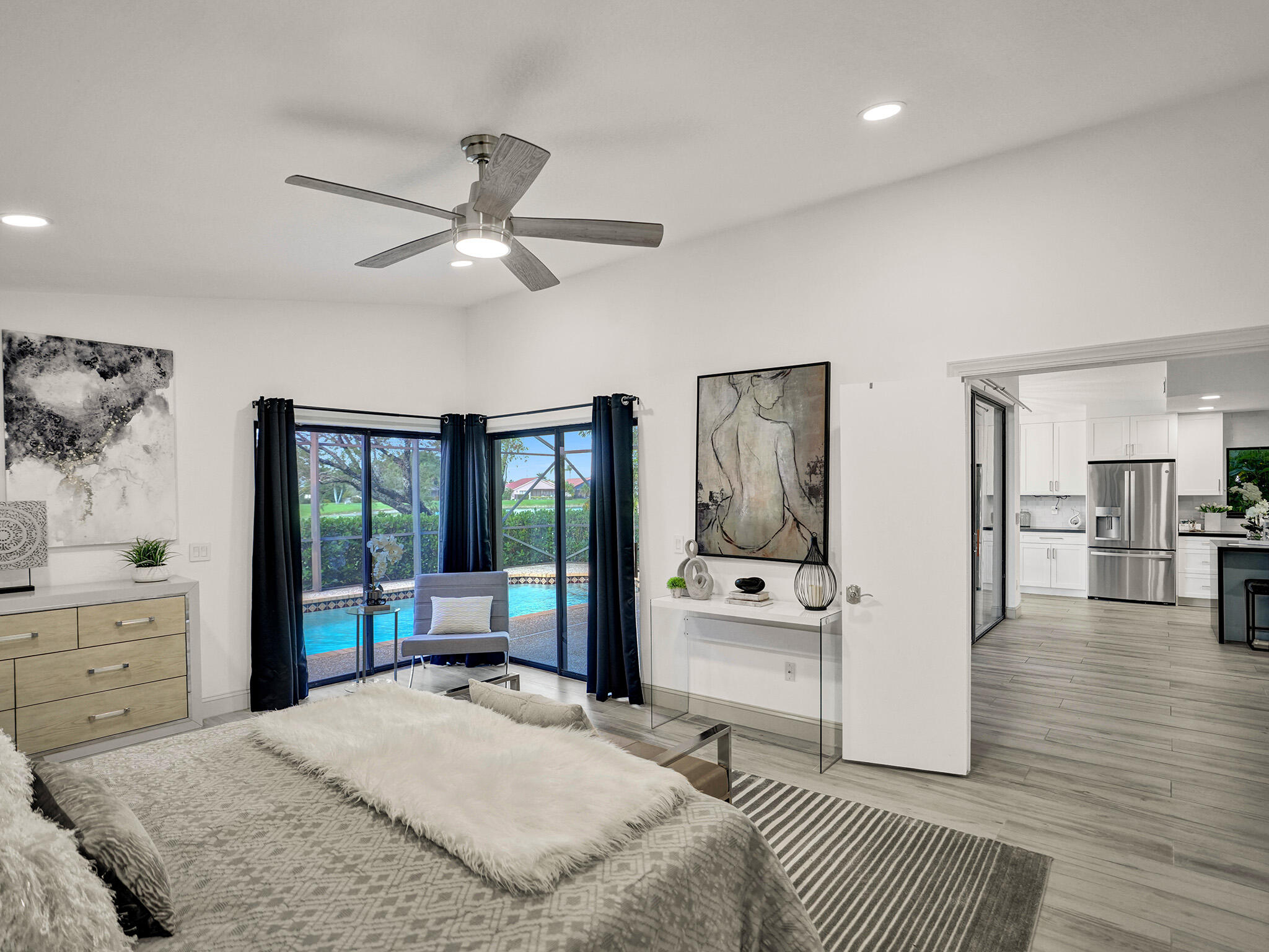 10698 Crystal Lake Drive Boca Raton, FL 33428 - Photo 17 of 48 a bedroom with a large bed and a view of bedroom
