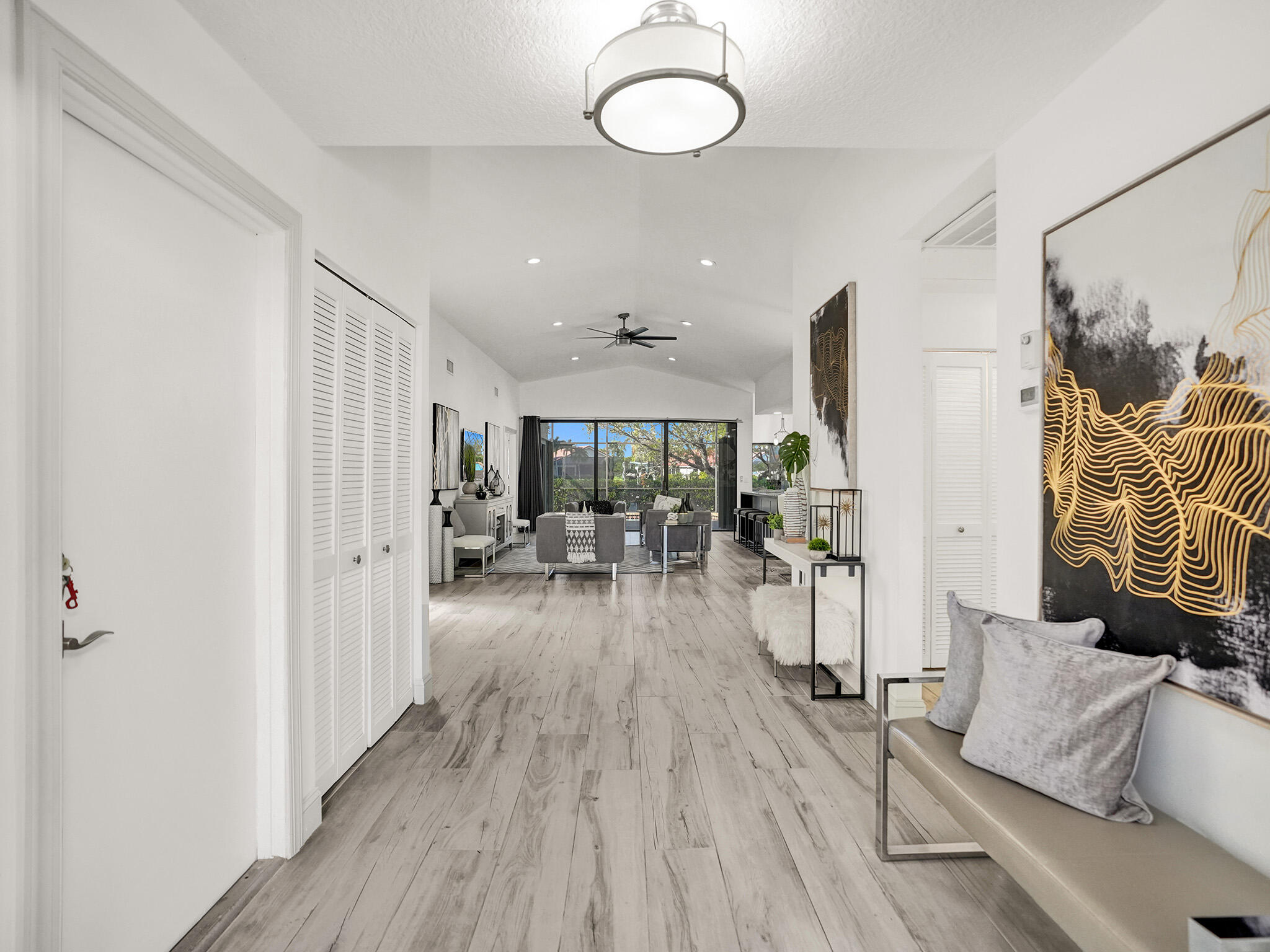 10698 Crystal Lake Drive Boca Raton, FL 33428 - Photo 2 of 48 a view of a livingroom with furniture and a ceiling fan