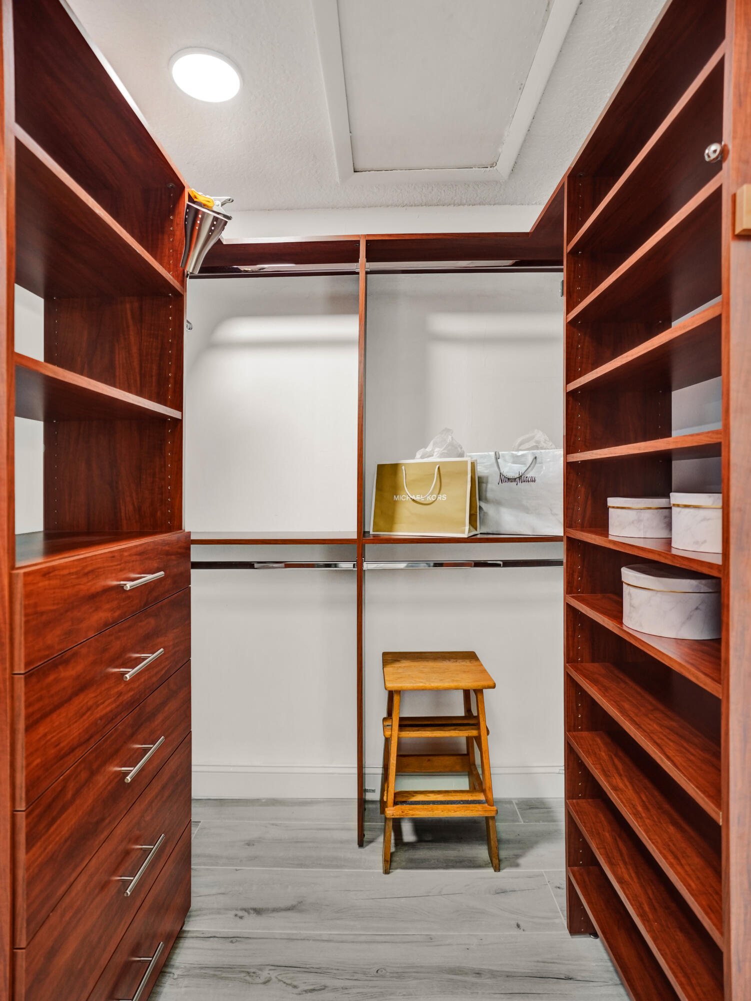 10698 Crystal Lake Drive Boca Raton, FL 33428 - Photo 21 of 48 a room with walk in closet and wooden floor