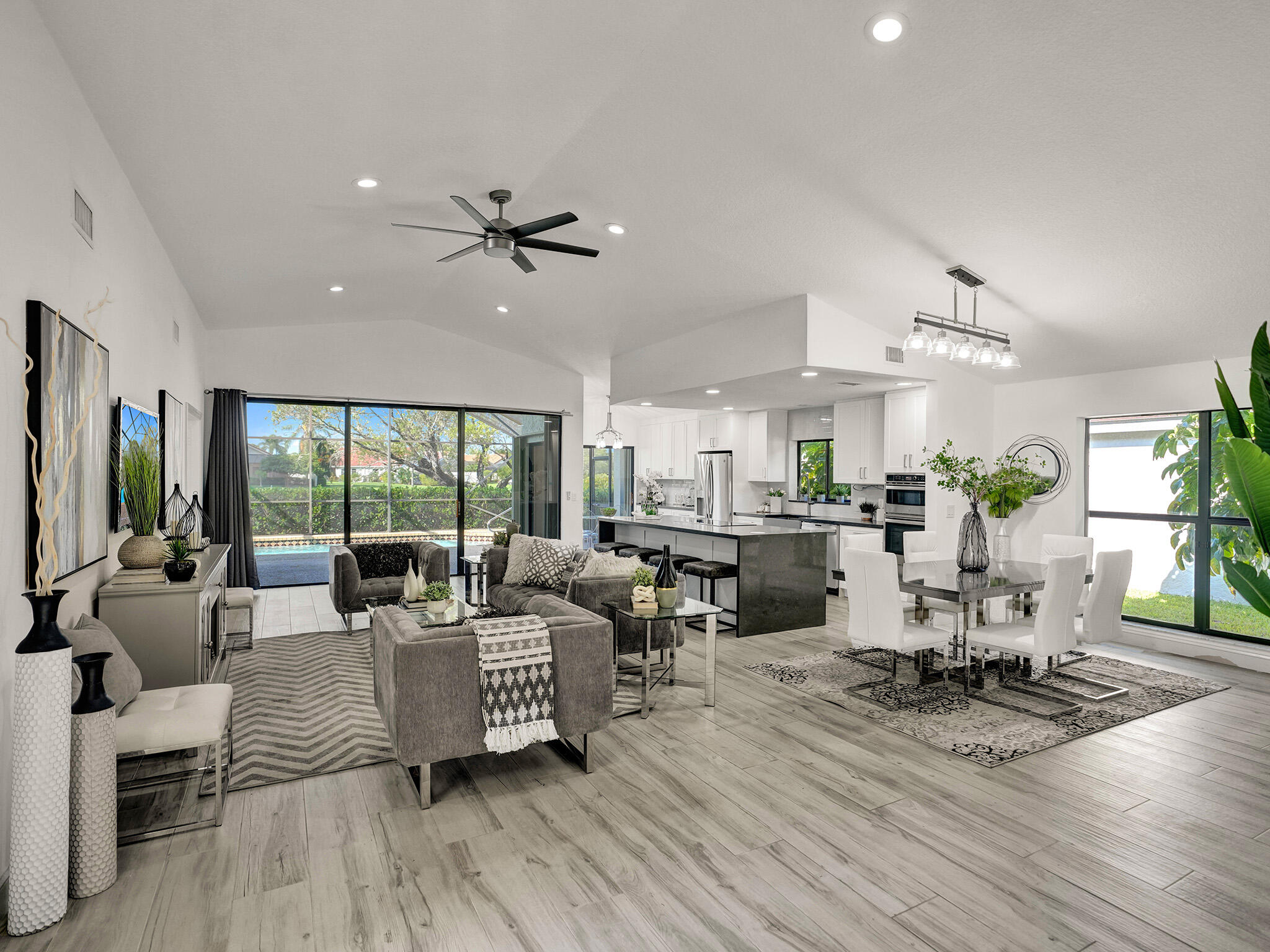 10698 Crystal Lake Drive Boca Raton, FL 33428 - Photo 3 of 48 a living room with fireplace furniture and a wooden floor