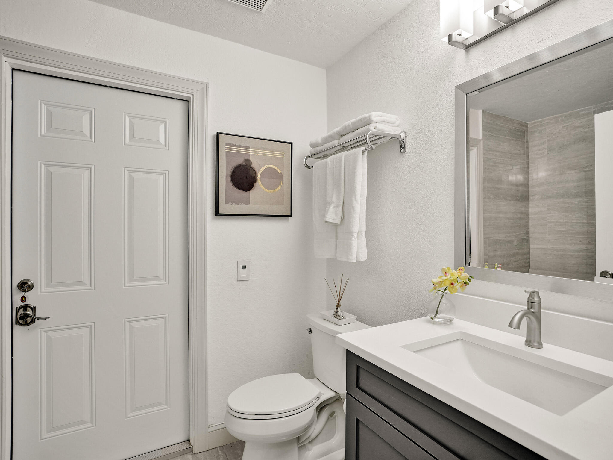 10698 Crystal Lake Drive Boca Raton, FL 33428 - Photo 33 of 48 a bathroom with a sink a toilet and shower