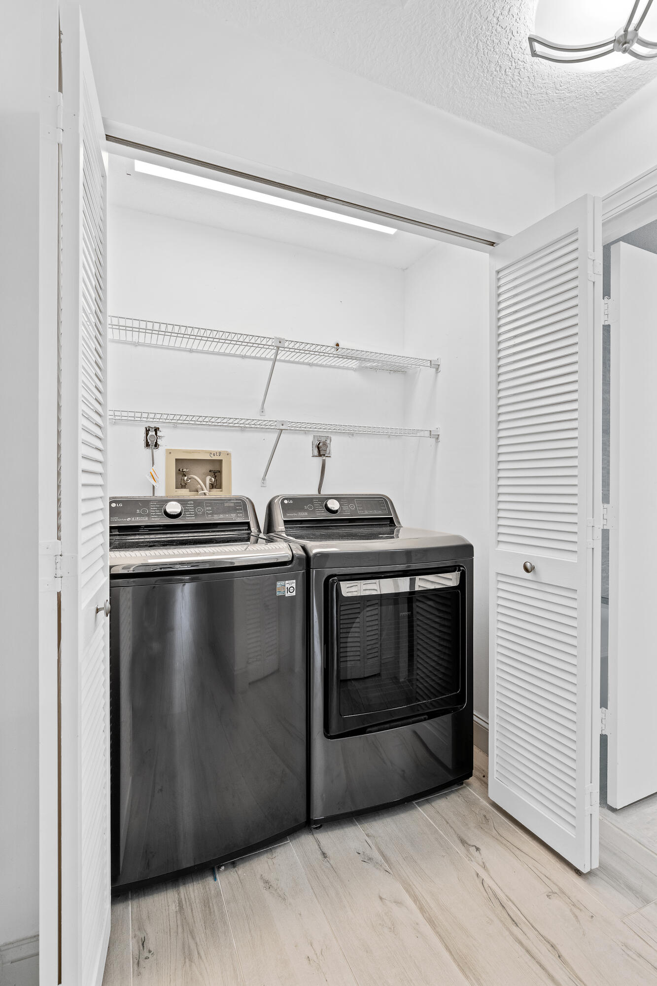 10698 Crystal Lake Drive Boca Raton, FL 33428 - Photo 36 of 48 a kitchen with a stove and a microwave