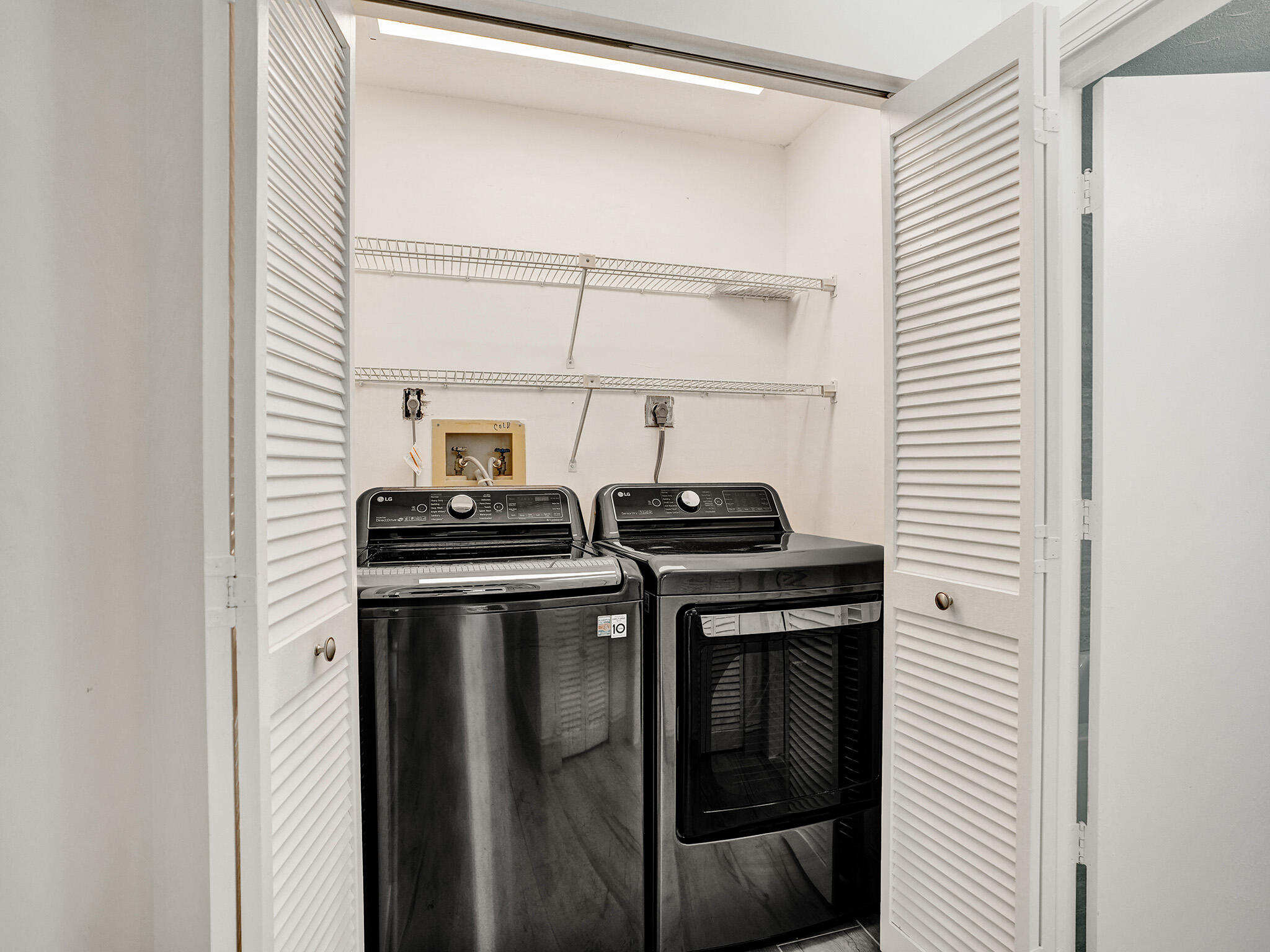 10698 Crystal Lake Drive Boca Raton, FL 33428 - Photo 37 of 48 a kitchen with a stove and a microwave