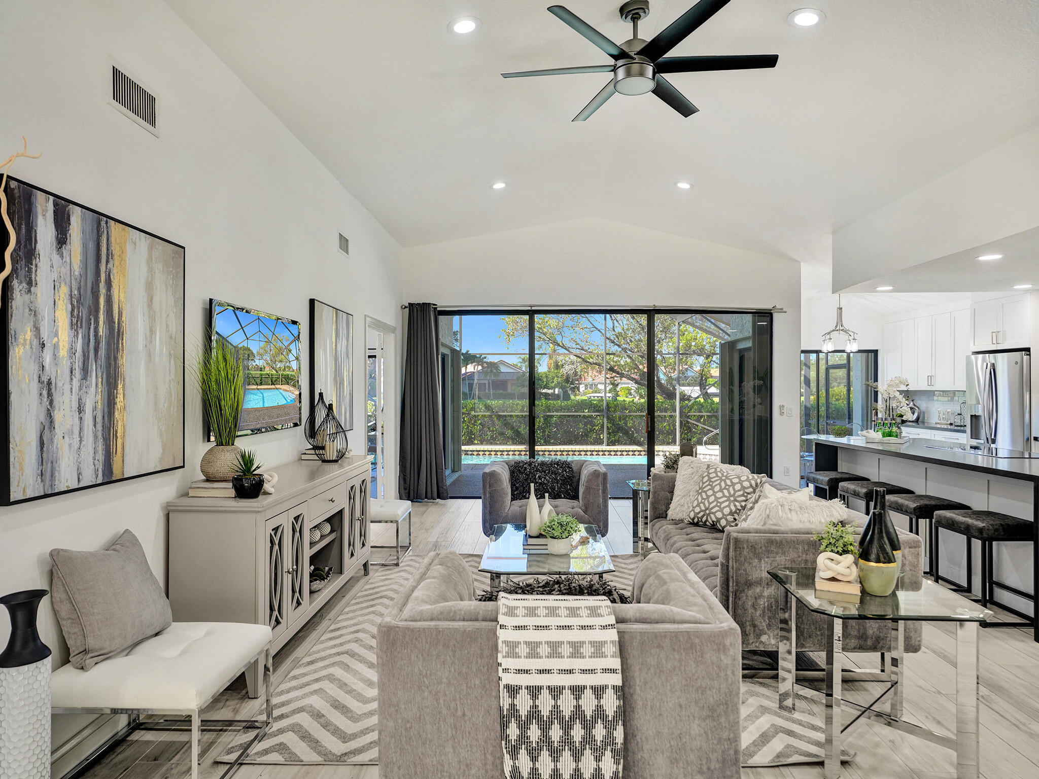 10698 Crystal Lake Drive Boca Raton, FL 33428 - Photo 4 of 48 a living room with furniture and a large window