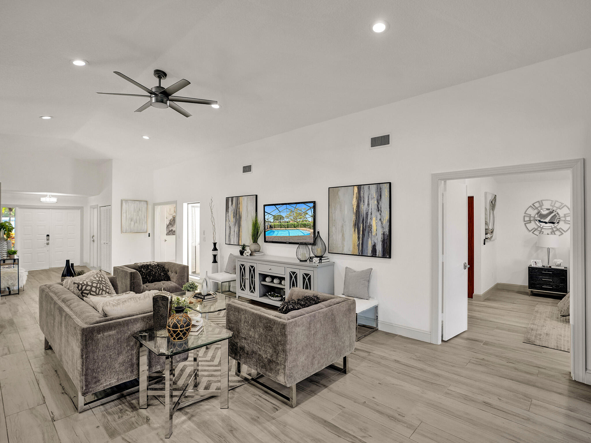10698 Crystal Lake Drive Boca Raton, FL 33428 - Photo 6 of 48 a living room with furniture and wooden floor