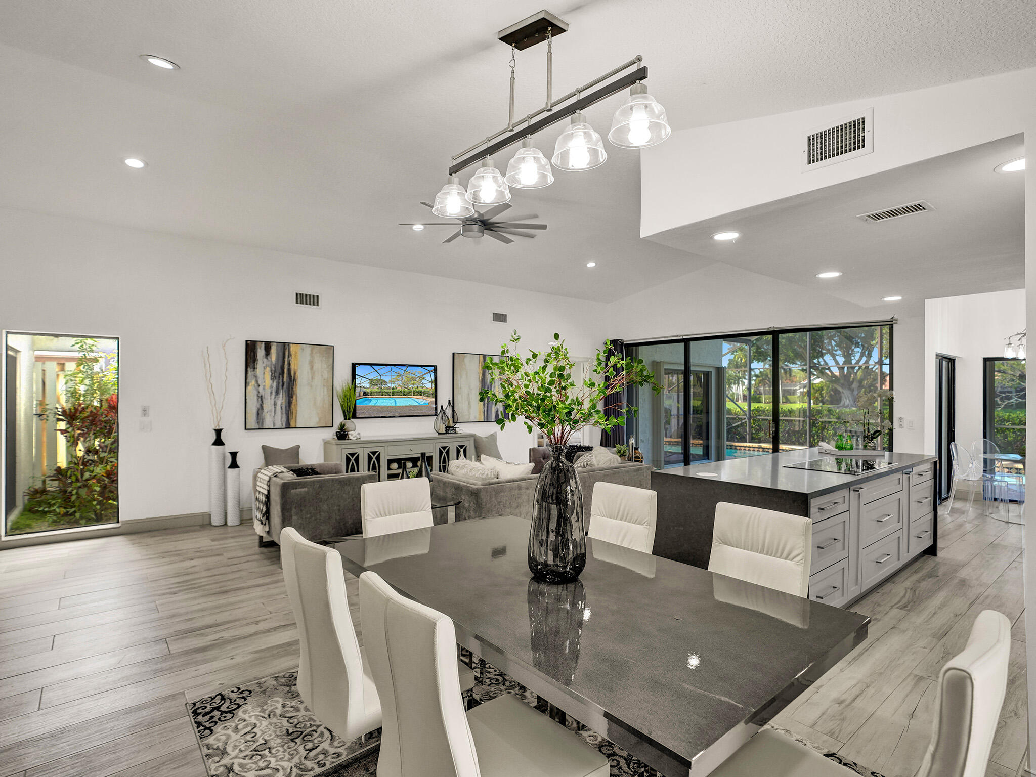 10698 Crystal Lake Drive Boca Raton, FL 33428 - Photo 10 of 48 a living room with fireplace furniture and a large window
