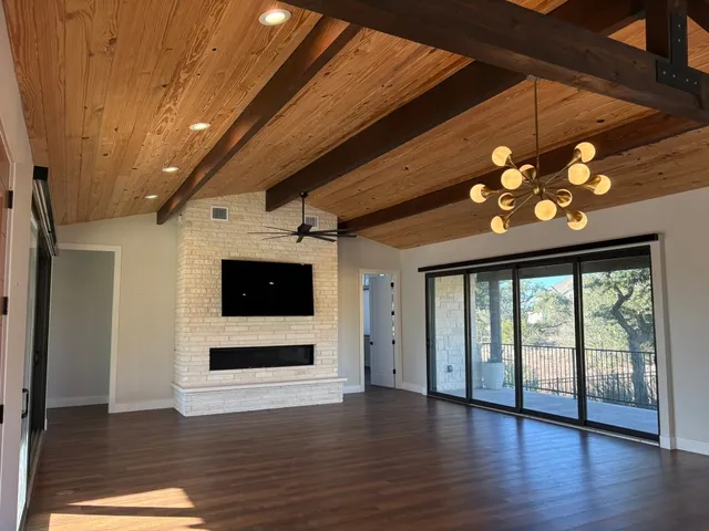 a kitchen with stainless steel appliances granite countertop a sink a stove and a refrigerator