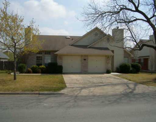 12311 Turtle Rock Road Austin, TX 78729 - Photo 1 of 1 a front view of a house with a yard and garage