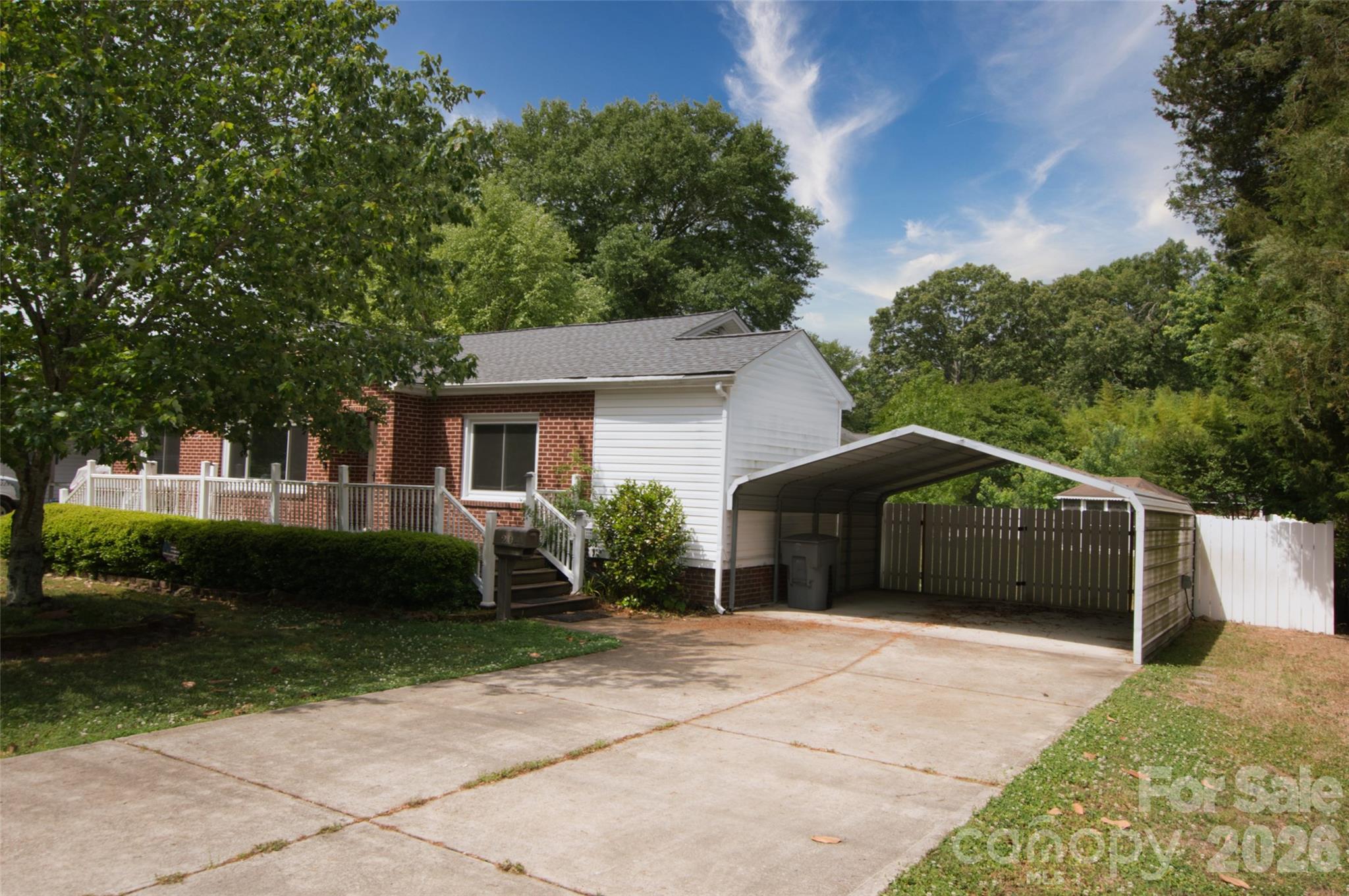204 Clinton Avenue Clover, SC 29710 - Photo 2 of 26 a front view of a house with a garden