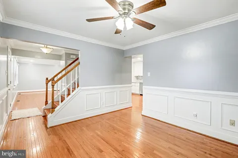 a view of an entryway with wooden floor