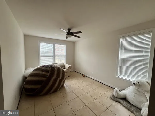 a living room with a couch and a window