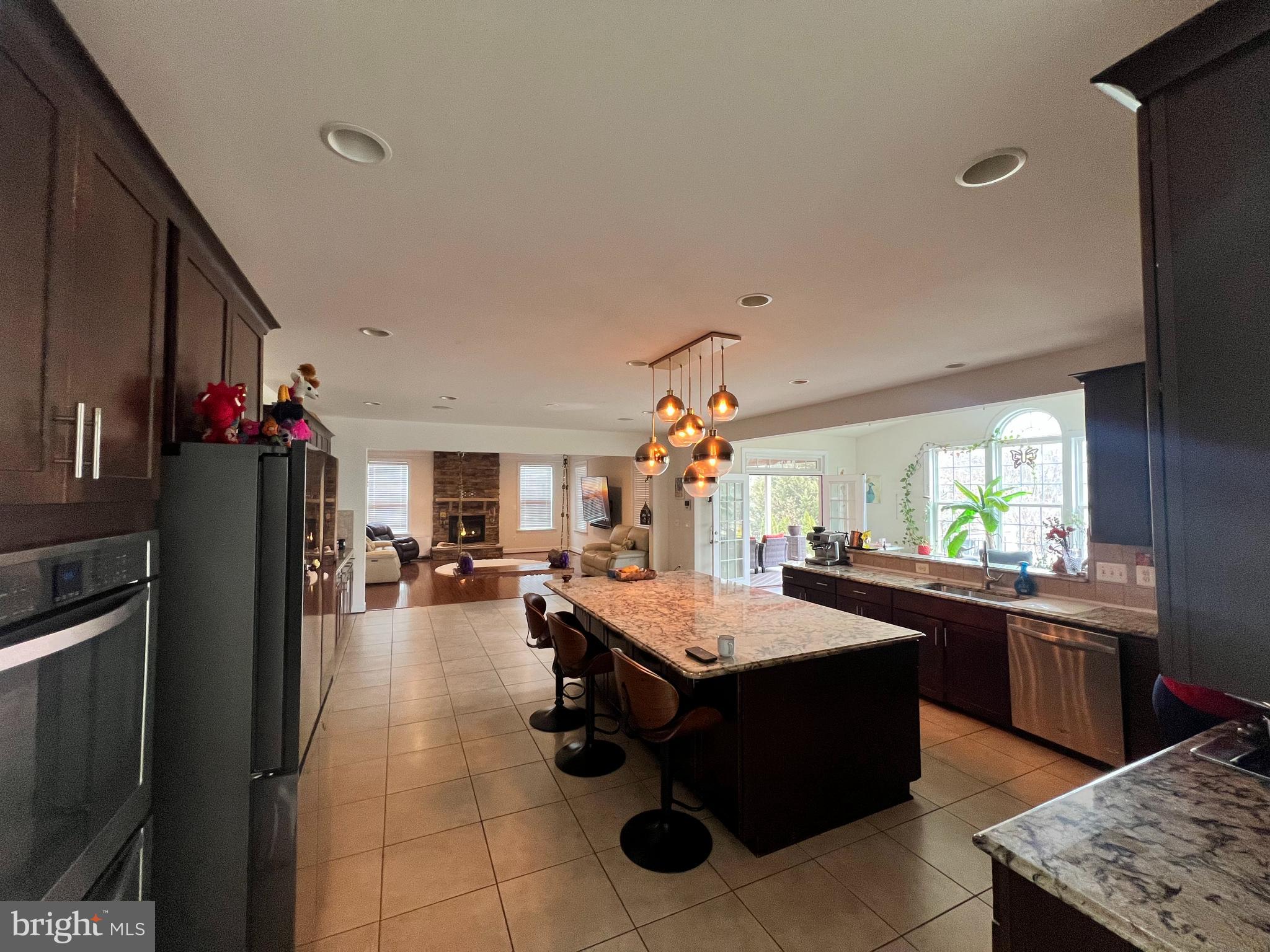 42443 Reservoir Ridge Place Ashburn, VA 20148 - Photo 12 of 22 a kitchen with a sink stove and refrigerator