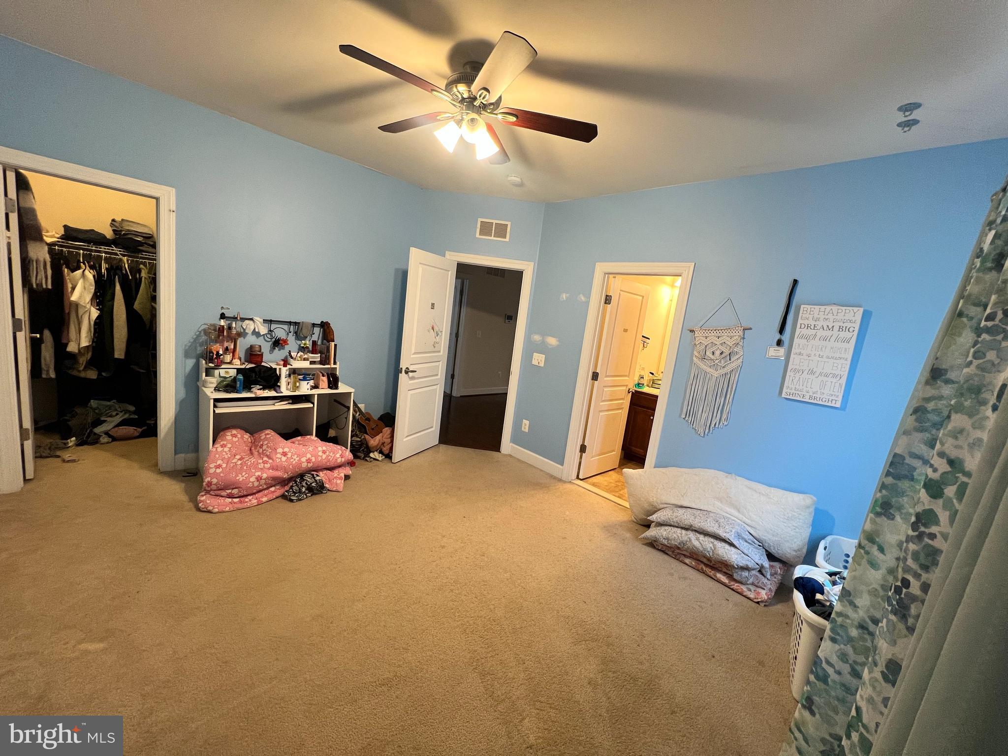 42443 Reservoir Ridge Place Ashburn, VA 20148 - Photo 18 of 22 a bedroom with a bed and a chandelier