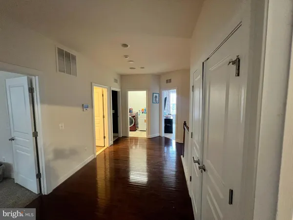 a large bathroom with a tub a sink a mirror and a shower
