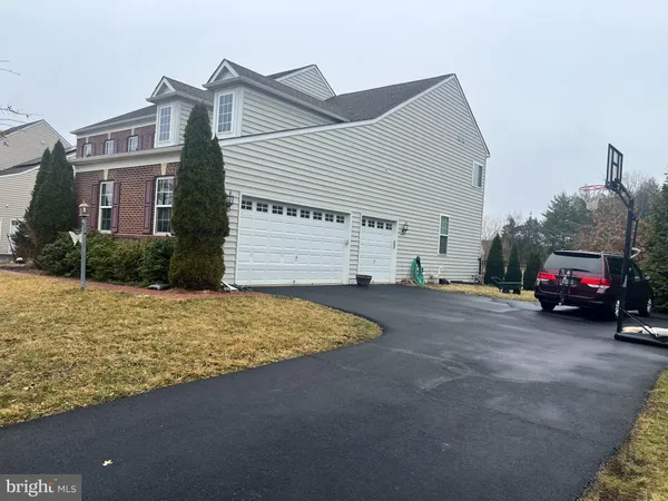 a view of a car park in front of house