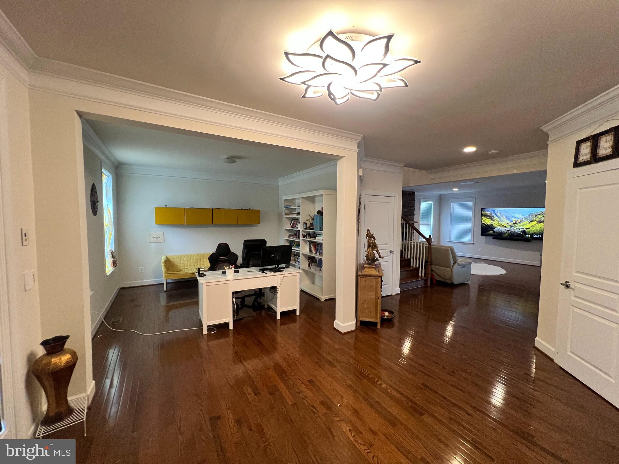 42443 Reservoir Ridge Place Ashburn, VA 20148 - Photo 5 of 22 a living room with furniture and a wooden floor
