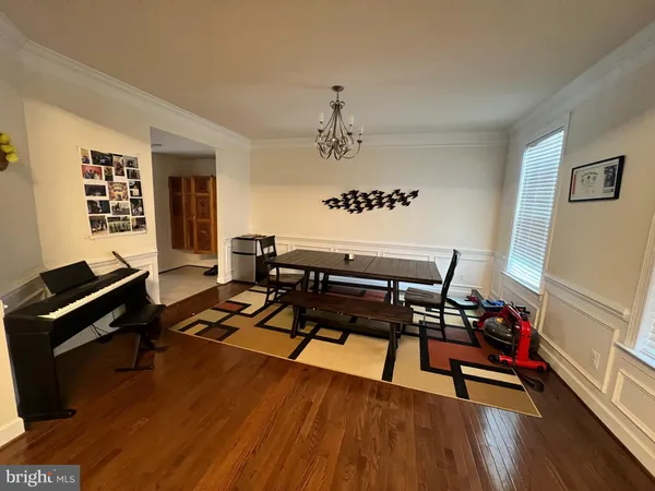 a living room with furniture fireplace and wooden floor