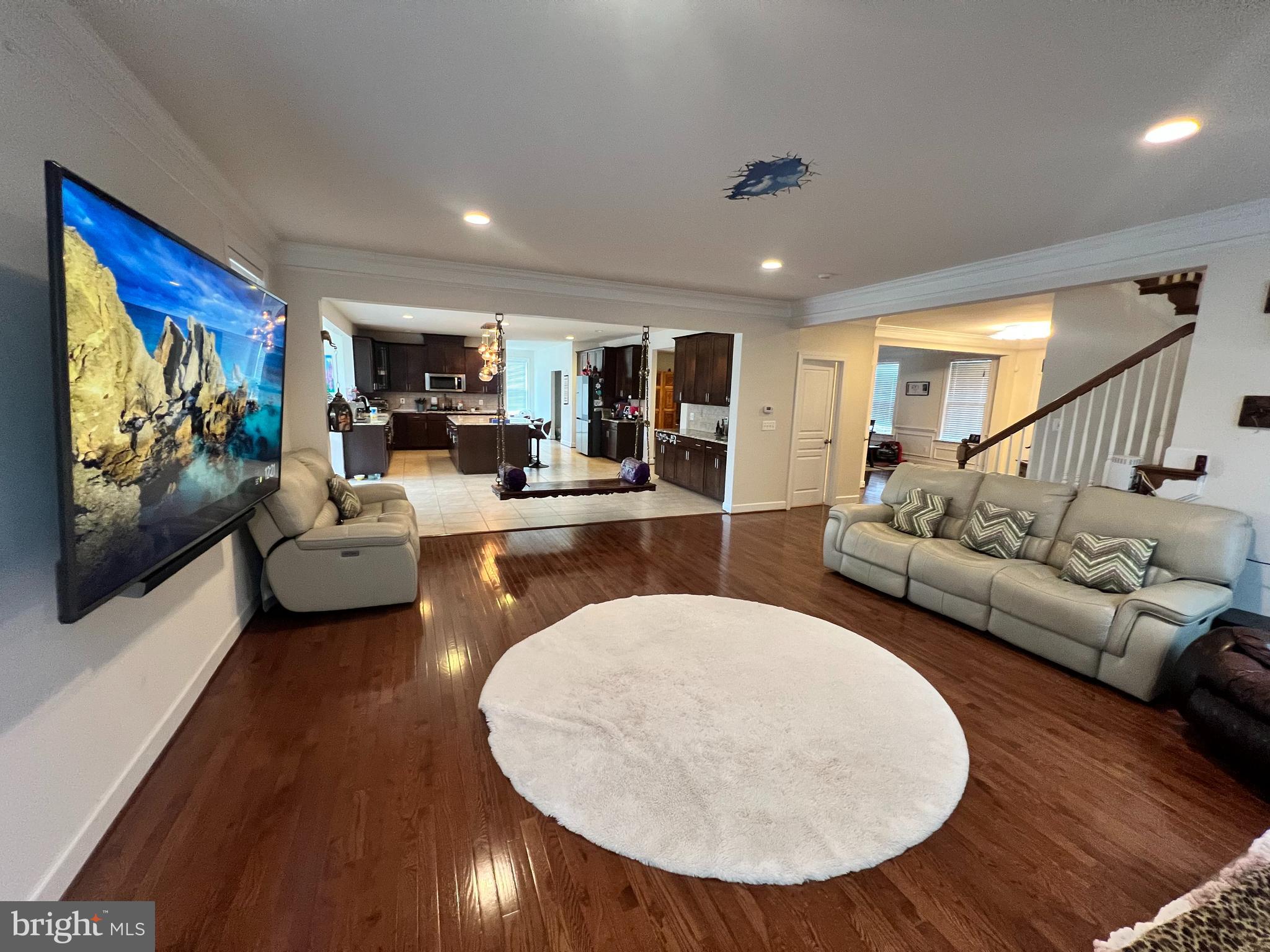 42443 Reservoir Ridge Place Ashburn, VA 20148 - Photo 7 of 22 a living room with furniture and a wooden floor