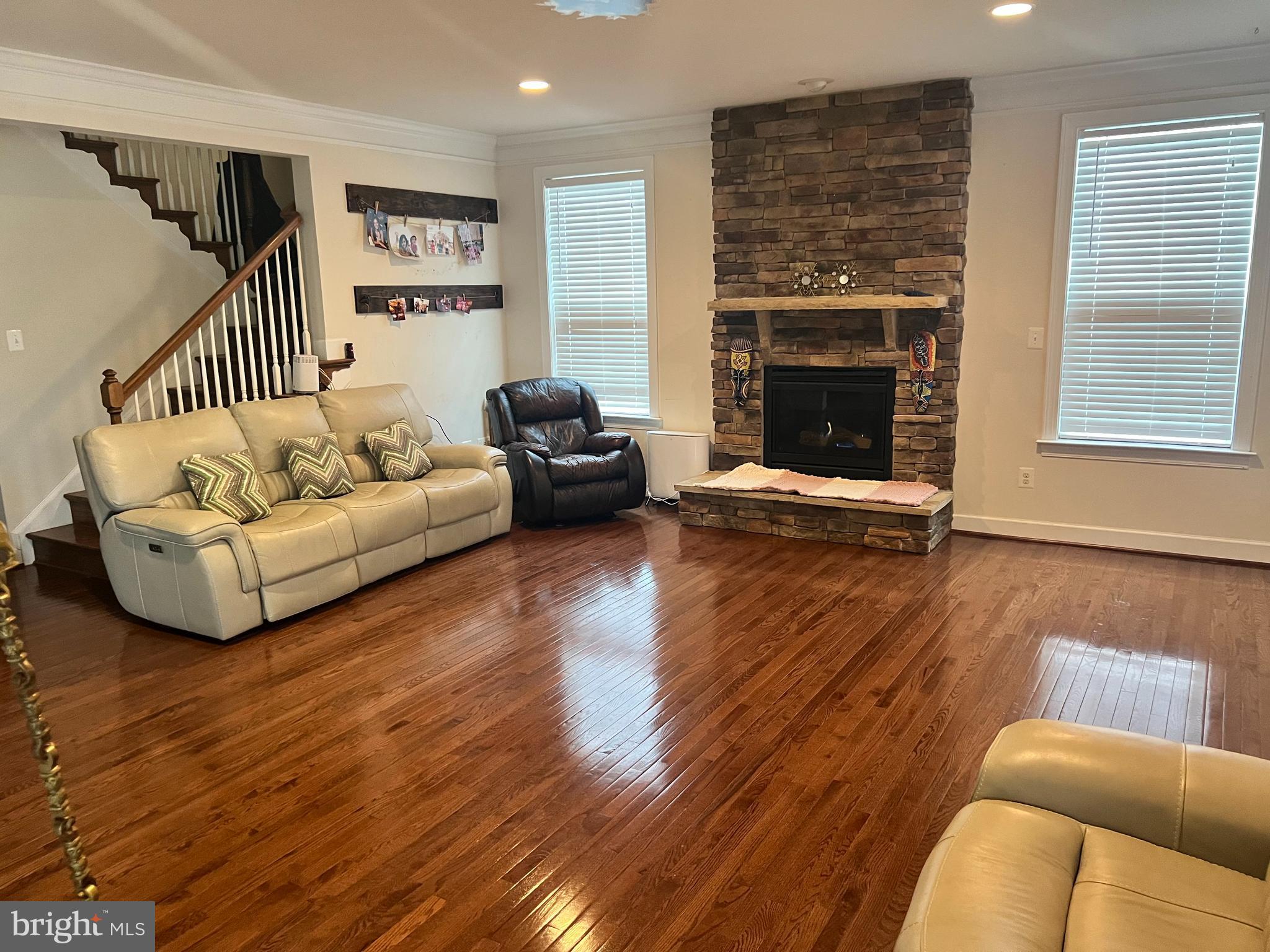 42443 Reservoir Ridge Place Ashburn, VA 20148 - Photo 9 of 22 a living room with furniture and a fireplace