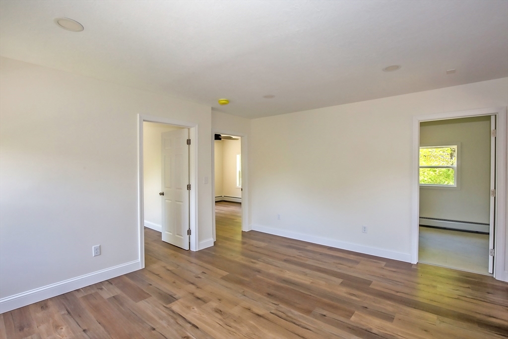165 Sandisfield Road Sandisfield, MA 01255 - Photo 25 of 37 a view of empty room with wooden floor and window